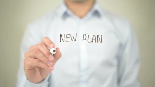 New Plan New Start , man writing on transparent screen