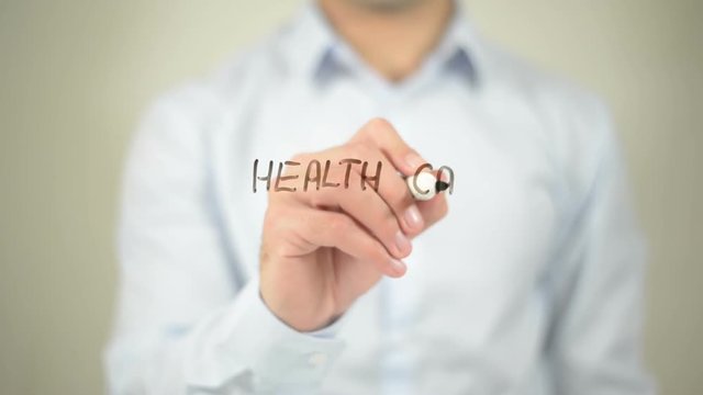 Health Care Reform , man writing on transparent screen