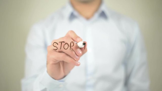 Stop Boycott , man writing on transparent screen