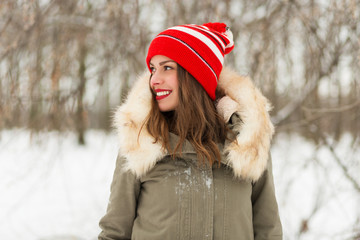 Beautiful woman in the winter park © Tinatin