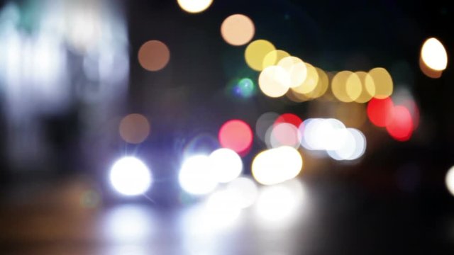 Wandering lights. Blurred city traffic at night
