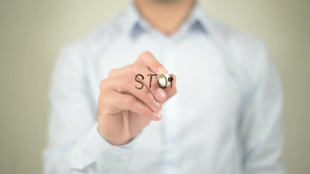 Stop Hate , man writing on transparent screen
