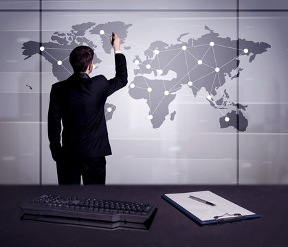 Business Person Drawing Dots On World Map