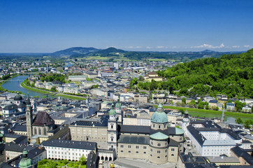 Obraz premium Panoramic aerial view of historical center and architecture of Salzburg, Austria. Beautiful view from Fortress Hohensalzburg. Spring or summer landscape, city and river. 
