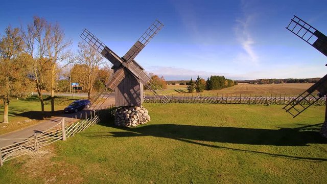 The old propeller of the windmill in Angla. There is a small road along the big rice field on the side of the road