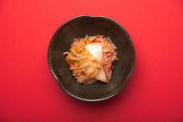 kimchi with red background - obrazy, fototapety, plakaty
