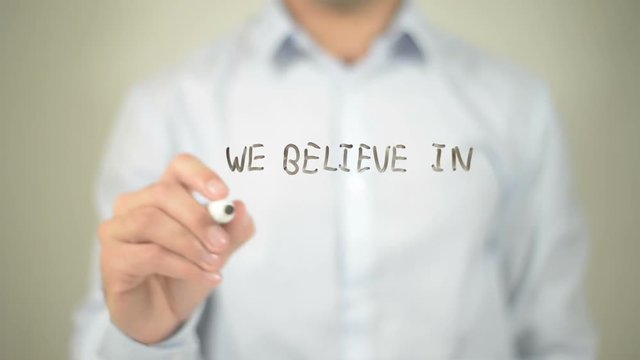 We Beleve In Making A Difference , man writing on transparent screen
