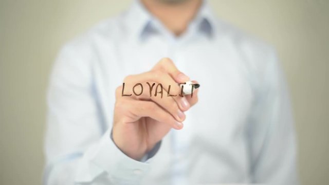 Loyality Scores, man writing on transparent screen