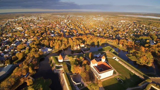 The aerial shot of the city of Kuressaare. Seen the big castle in the middle of the city being surrounded with lots of trees