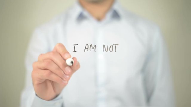I Am Not A Number , man writing on transparent screen