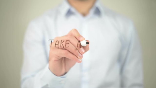 Take A Trip , man writing on transparent screen