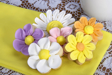 Home made designer Flower Sugar cookies on yellow napkin