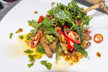 Stir fried duck spicy with crispy basil the delicious Thai food.