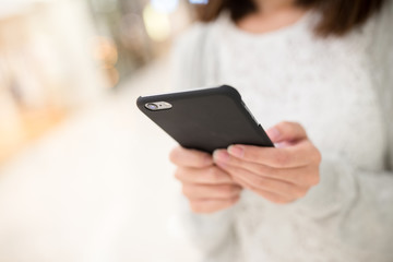 Woman browsing internet on mobile phone