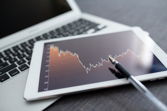 Stock market analyze with digital tablet