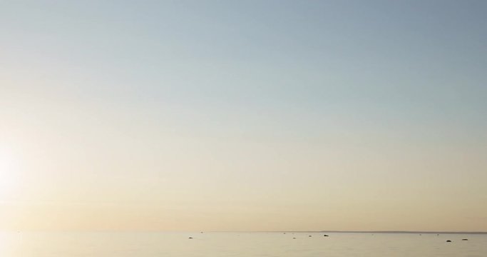 sunset timelapse over fin gulf baltic sea with small clouds and volumetric light, 4k prores footage