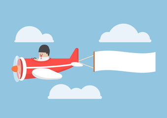 Businessman flying by the airplane with banner