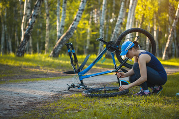 woman repair her bicycle