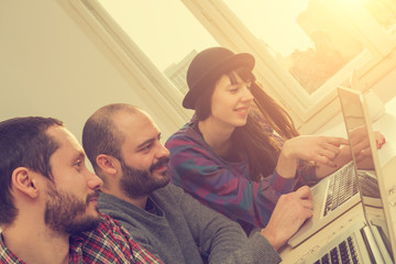 Young group of people/architects discussing business plans.