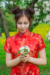 Beautiful asian girl in traditional chinese red dress.