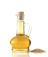 Sesame Oil / High resolution image of sesame oil decanter with sesame seeds shot in studio on white background
