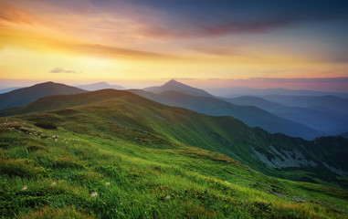 Fototapeta premium Mountain valley during sunrise. Natural summer landscape.