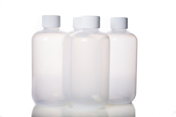 Close up white bottles on white background