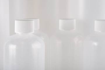 Close up white bottles on white background