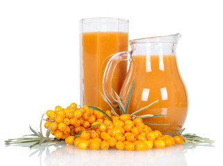 Pitcher,  glass  juice from  berries  sea buckthorn isolated on white.