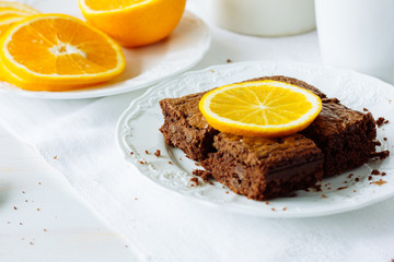 Pieces of chocolate brownie with orange