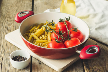Penne and tomato in pot