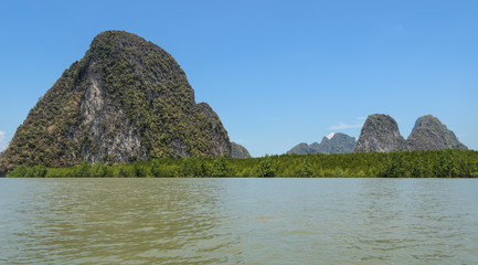 Fototapeta na wymiar Limestone island with mangrove forest in Phang Nga Bay National park, Thailand