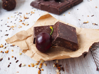 Still life of broken chocolate bar  on wooden table