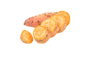 Fresh sweet potatoes whole and sliced , isolated on white background