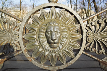 Front view of lion head in round frame. Decoration