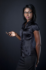 pretty african american businesswoman holing cellphone.