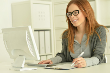 Attractive redhead woman in eyeglasses