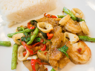 Rice with stir-fried seafood and basil