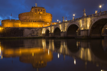 Fototapeta na wymiar Castel Sant Angelo bridge, reflecting onto the River Tiber at twilight, Rome, Italy, Europe