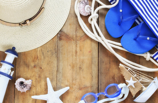 top view image of beach accessories on wooden deck