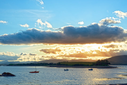  quiet bay with island near kenmare at sunset