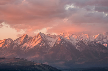 Cloudy Tatra mountains in the beautiful morning, covered with snow