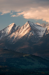Fototapeta premium Cloudy Tatra mountains in the morning, covered with snow