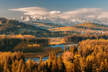 Beautiful autumns panorama over Bialka river gorge and Spisz highland to snowy Tatra mountains, Poland