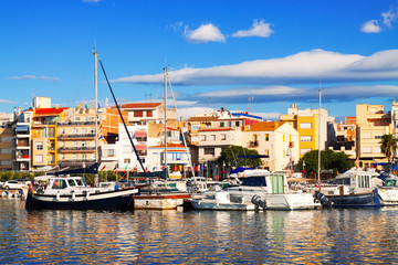 Fototapeta na wymiar View of typical mediterranean town from sea. L'Ampolla