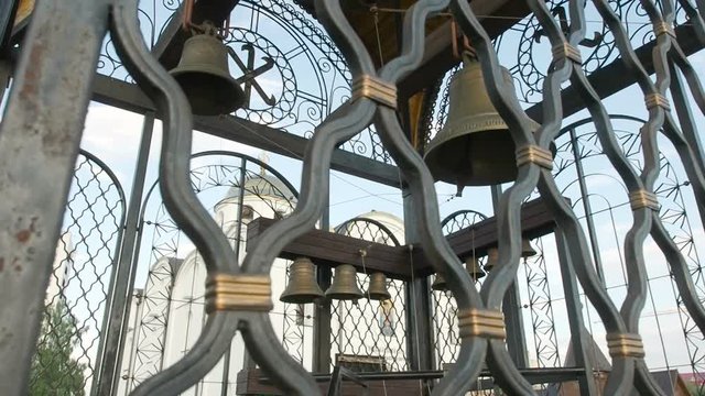Bell Tower curch, small and big bells, metal construction, daytime,outdoors