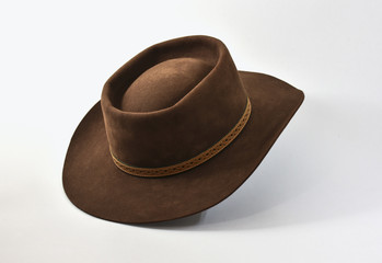 Brown felt hat or cowboy hat on white background