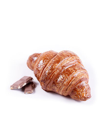 Tasty croissant with chocolate and jam isolated on white background. Pastries and bread in a bakery
