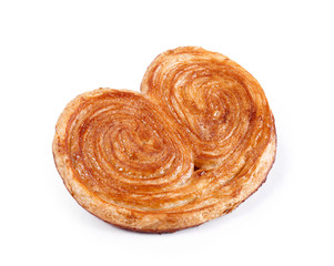 Sweet puff pastry isolated on white background - Palmeras. Pastries and bread in a bakery