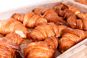 Sweet pastry, Croissants with chocolate and jam filling on shelf in Bakery shop. Pastries and bread in a bakery